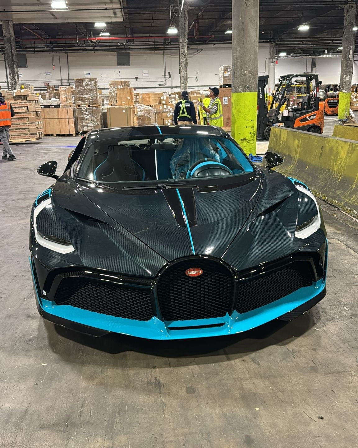 A collection of high-end luxury cars, including Bugatti, Rolls-Royce, Ferrari, and Bentley, ready for export.