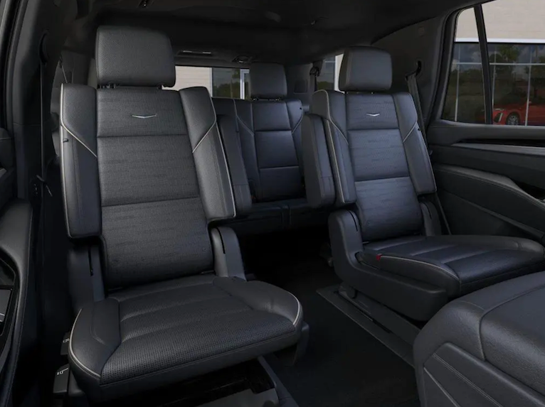 Backseat interior of a vehicle with gray leather seats
