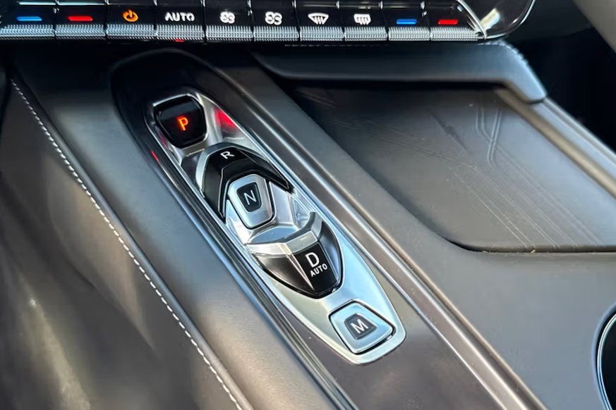 Car interior with gear shift and control panel