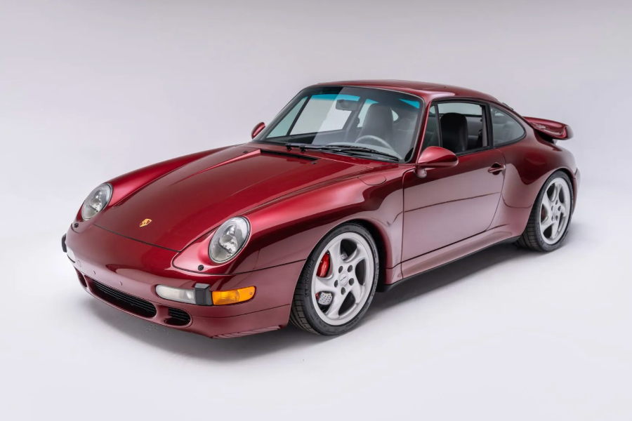 Red Porsche sports car on a white background