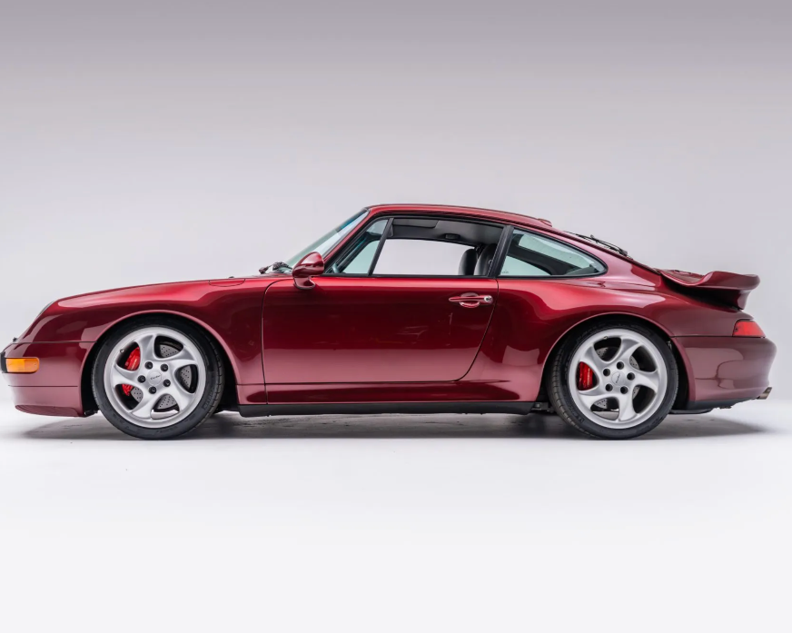 Maroon sports car on a white background