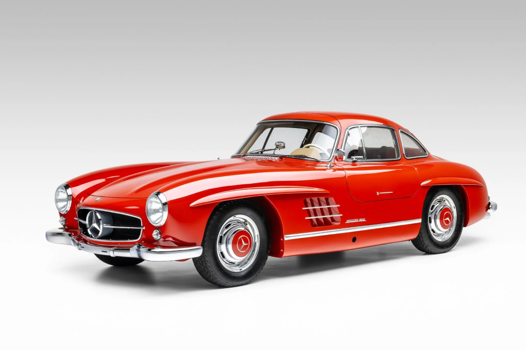 Red classic Mercedes-Benz car on a white background