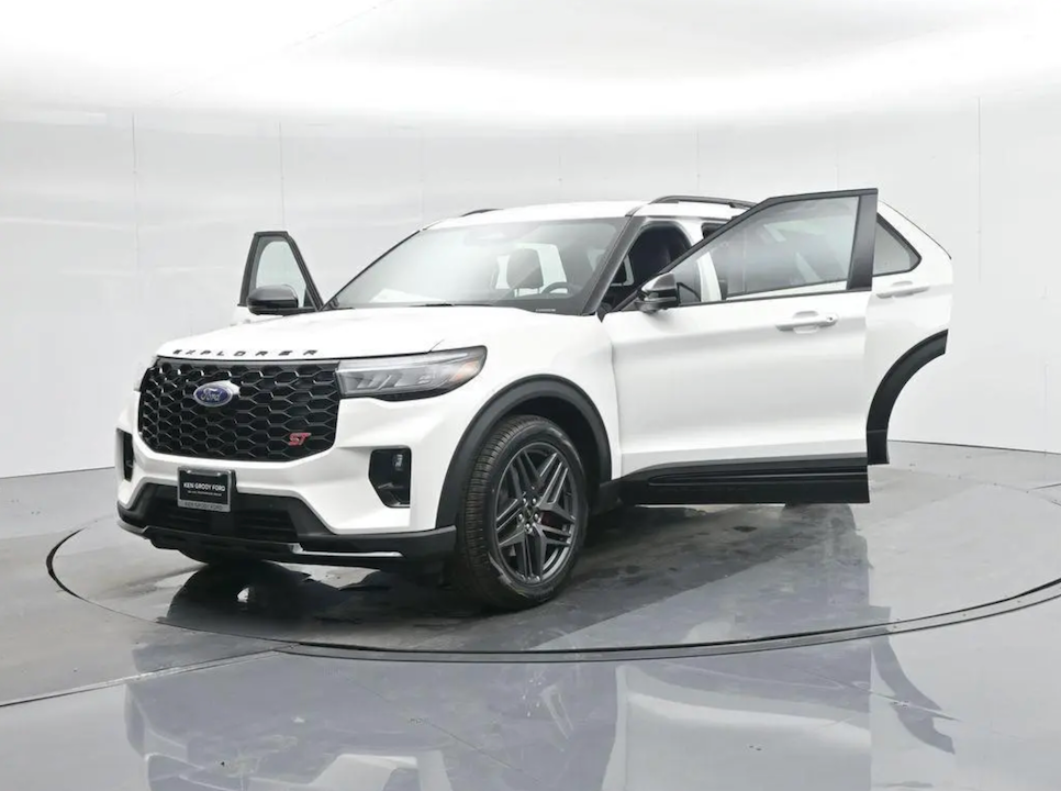 White SUV on a rotating platform with a plain background