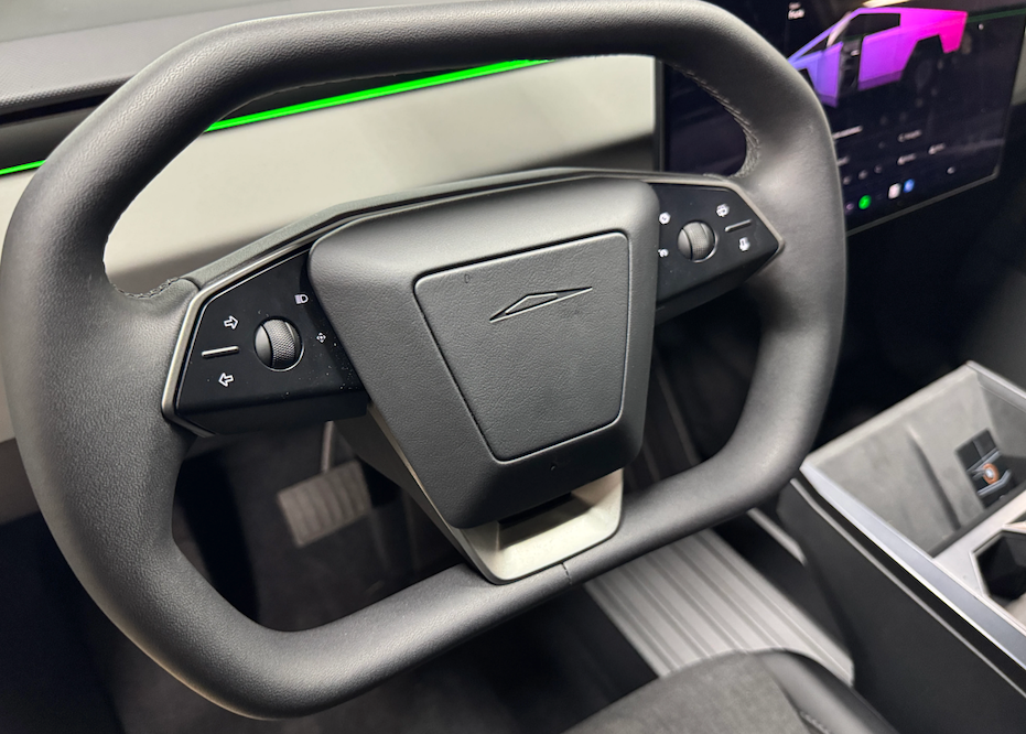 Steering wheel with brand logo in a car interior