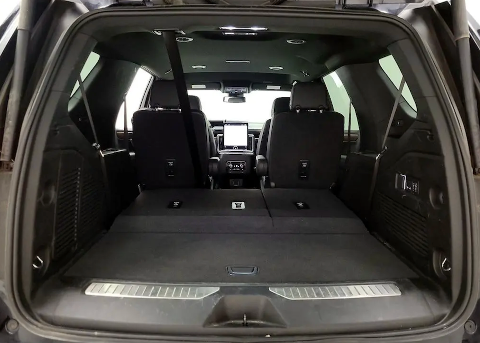 Open trunk of a car with a view of the interior.