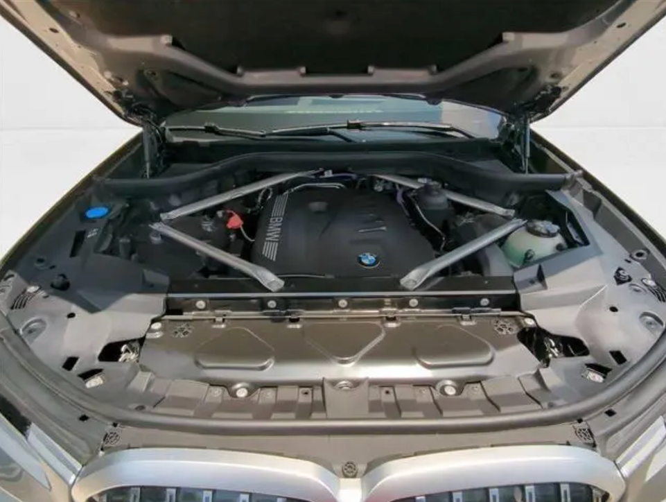 Car engine compartment with BMW logo