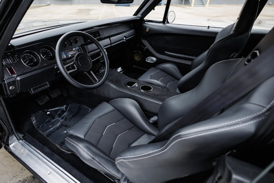 Car interior with black leather seats and dashboard.