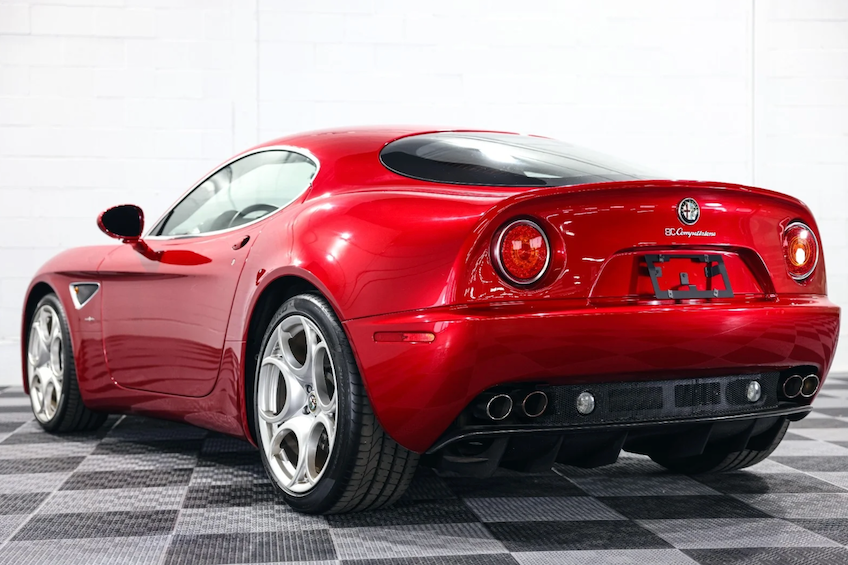 Red sports car on a checkered floor
