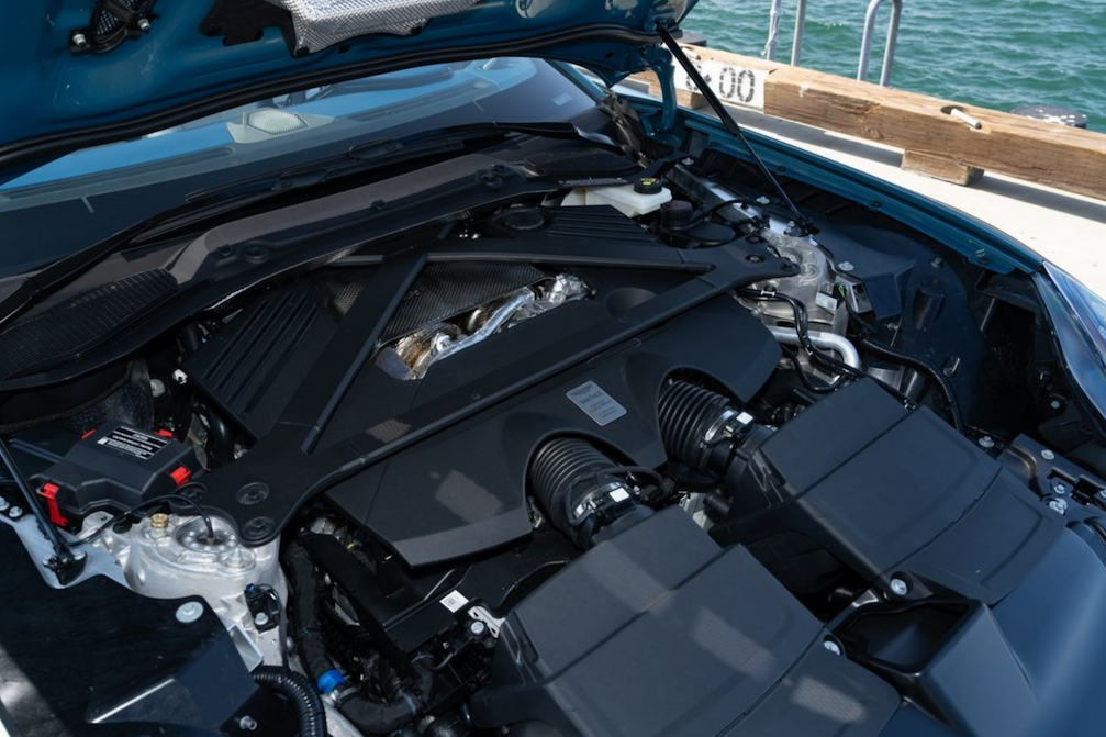 Engine compartment of a vehicle with water in the background