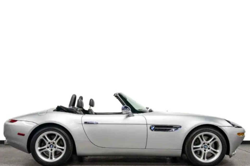 Silver convertible BMW on a white background