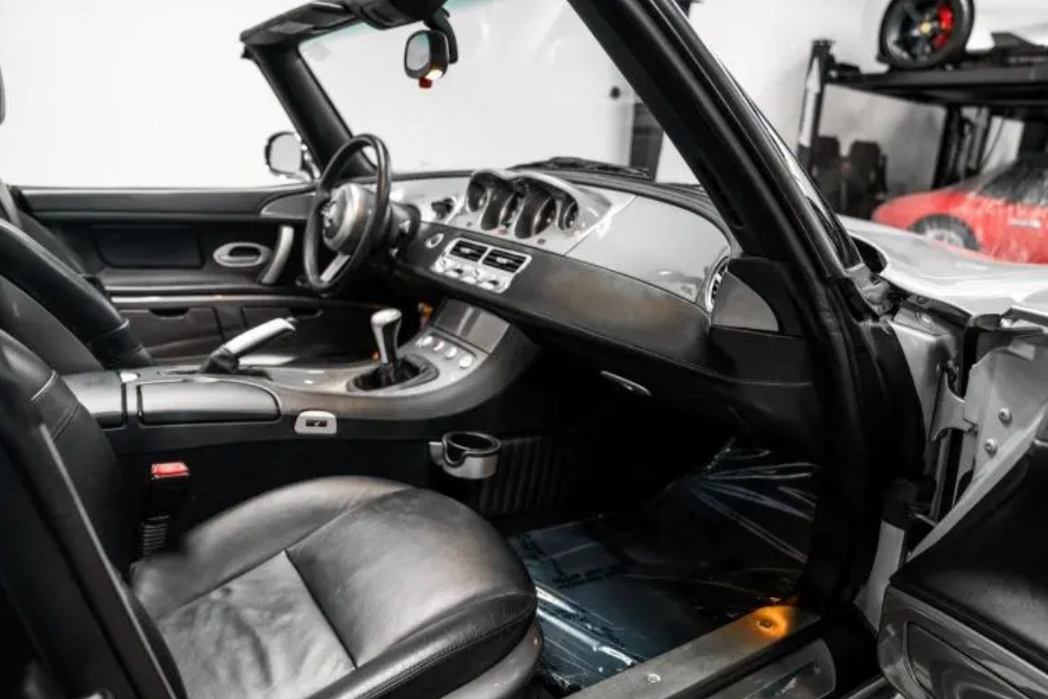 Car interior with a focus on dashboard and steering wheel