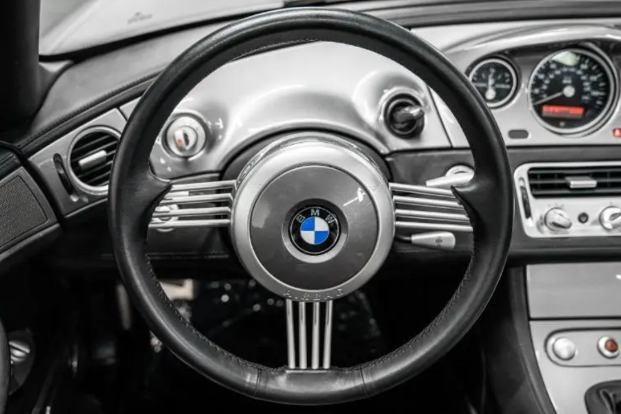 Car steering wheel with BMW logo in a vehicle interior