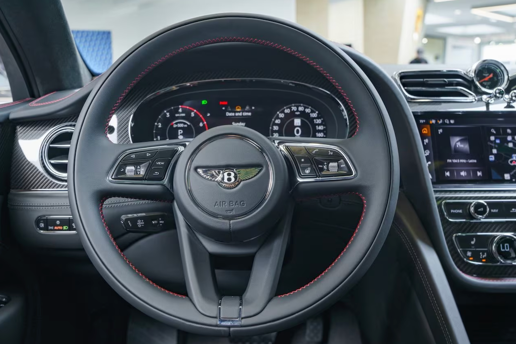 Steering wheel with Bentley logo in a car interior