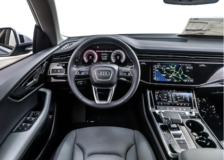 Audi car interior with steering wheel and dashboard