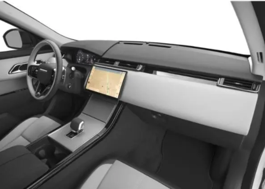 Car interior with a focus on the dashboard and steering wheel.
