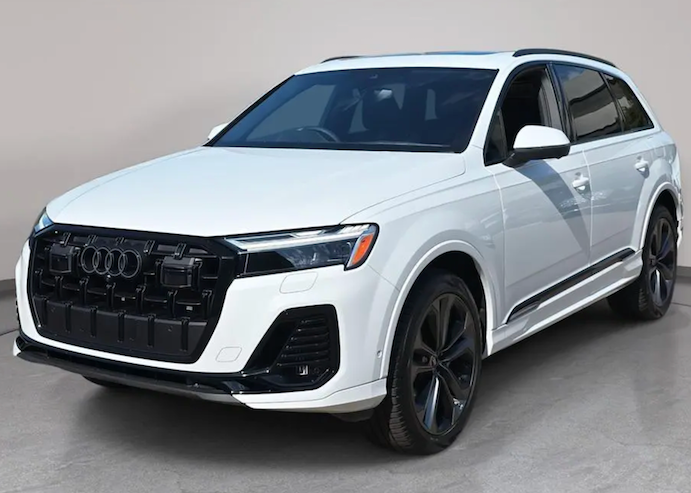 White Audi SUV on a gray floor with a neutral background
