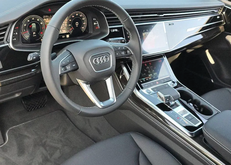 Car interior with steering wheel and dashboard of an Audi vehicle