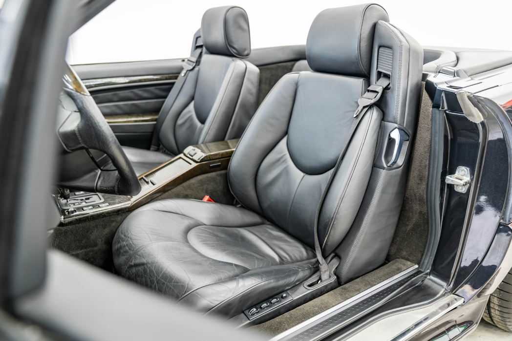 Close-up of a car's interior with gray leather seats.