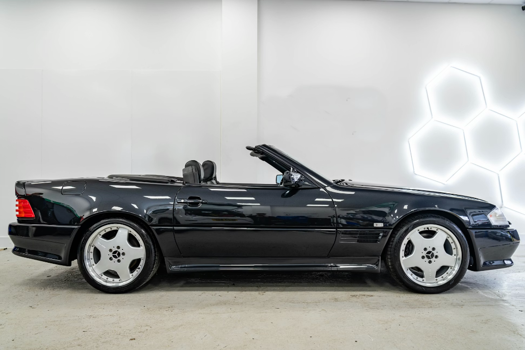 Black convertible car on a white background