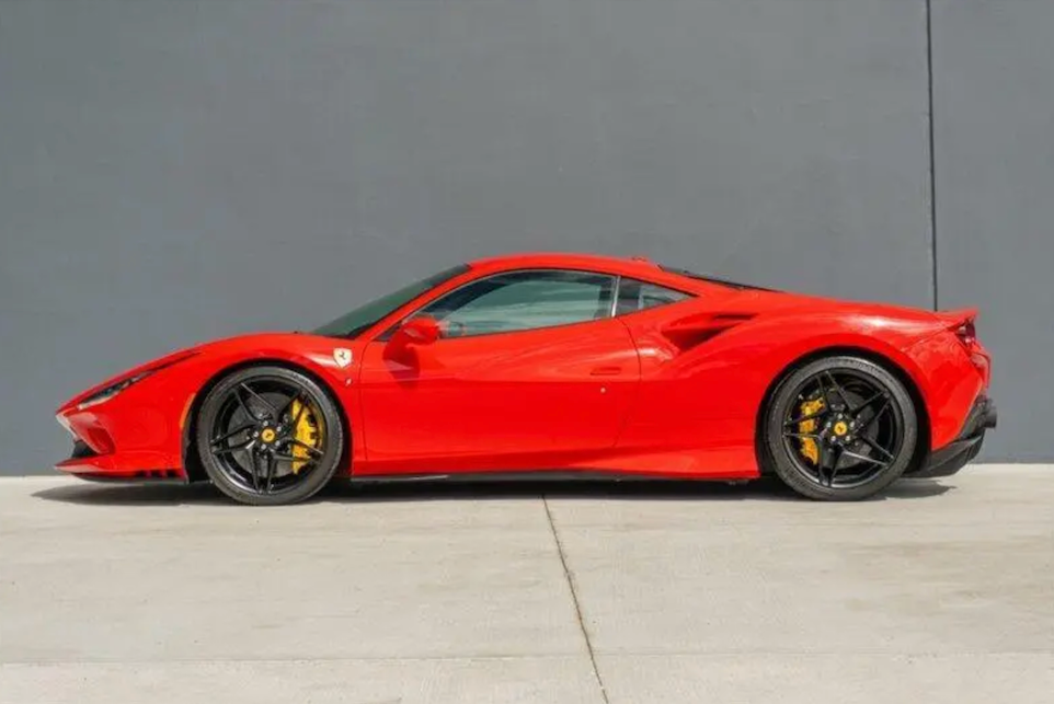 Red sports car on a gray background
