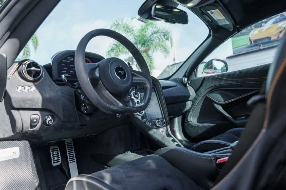 Car interior with steering wheel and dashboard view