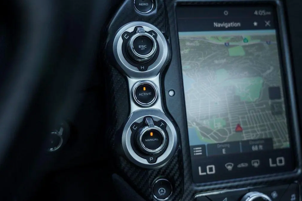 Car dashboard with navigation system and control buttons