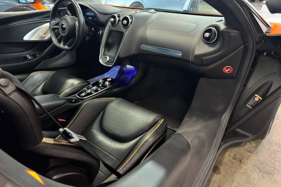 Car interior with black leather seats and dashboard