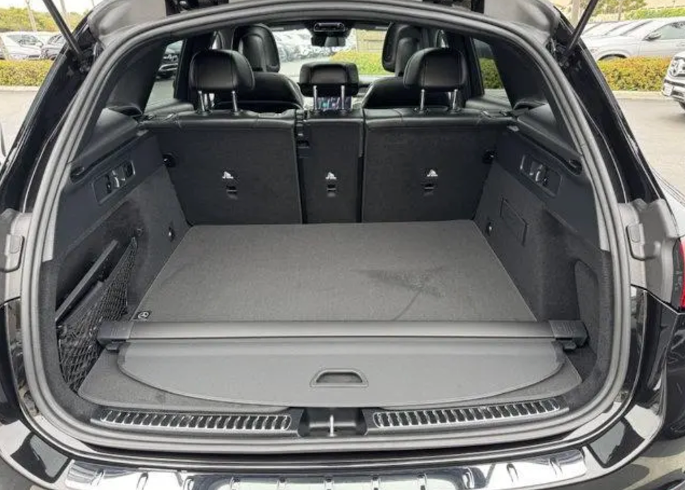 Open trunk of a car with folded cargo cover