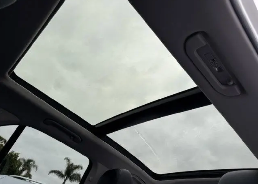 Car interior with a sunroof on a cloudy day