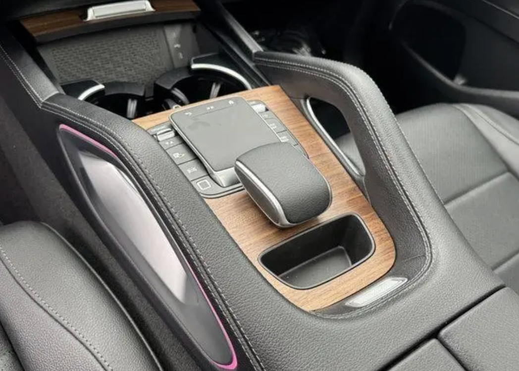 Car interior with a gear shift and cup holder