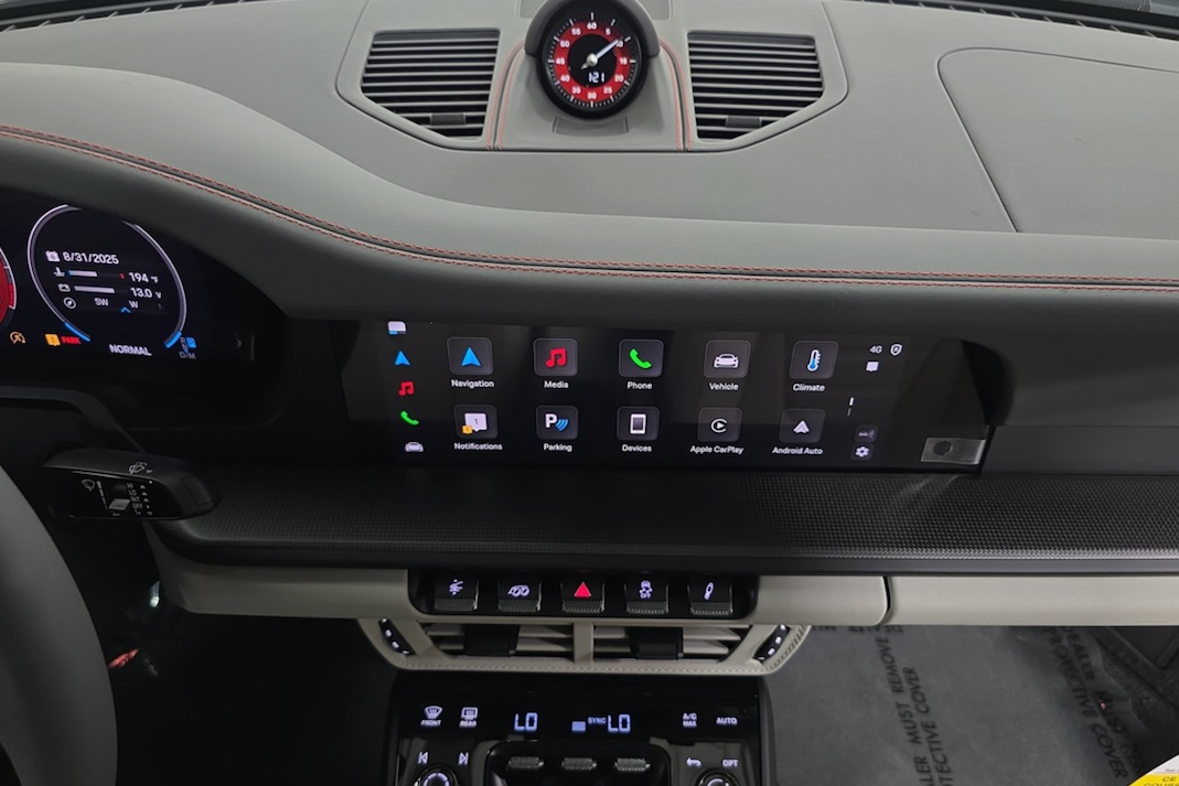 Car dashboard with digital display and control buttons