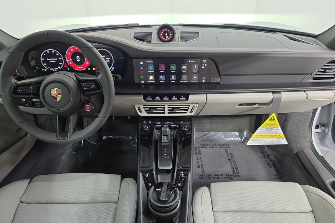 Car interior with steering wheel and dashboard in a Porsche vehicle