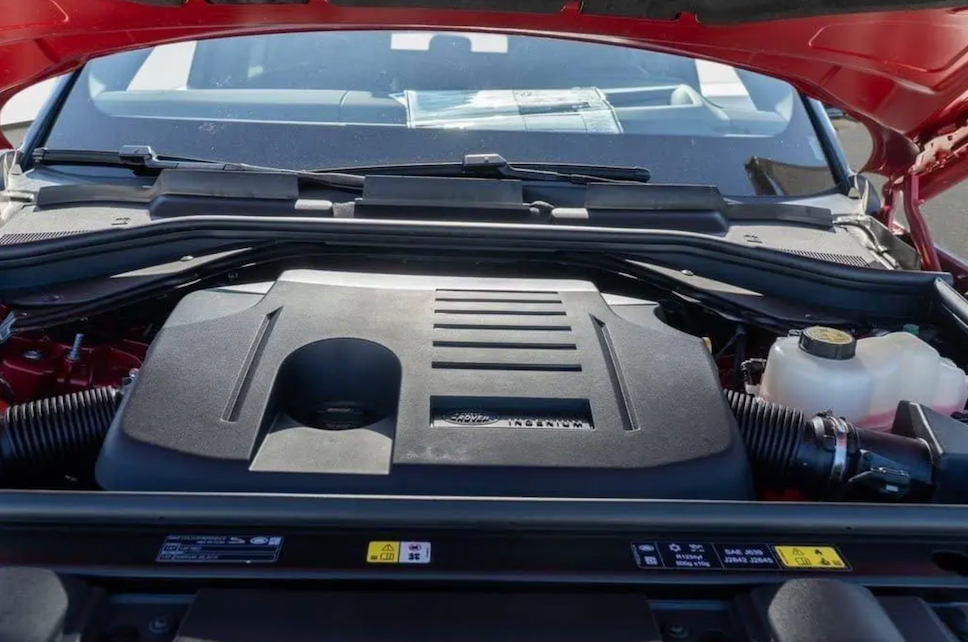 Car engine compartment with open hood
