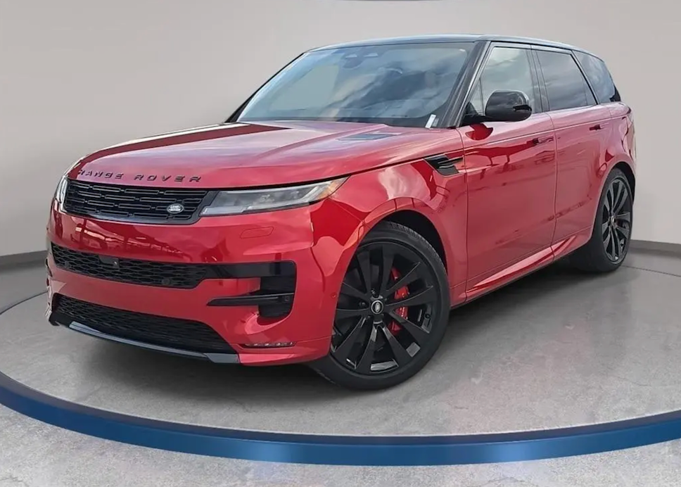 Red Range Rover on a gray floor with a white wall background