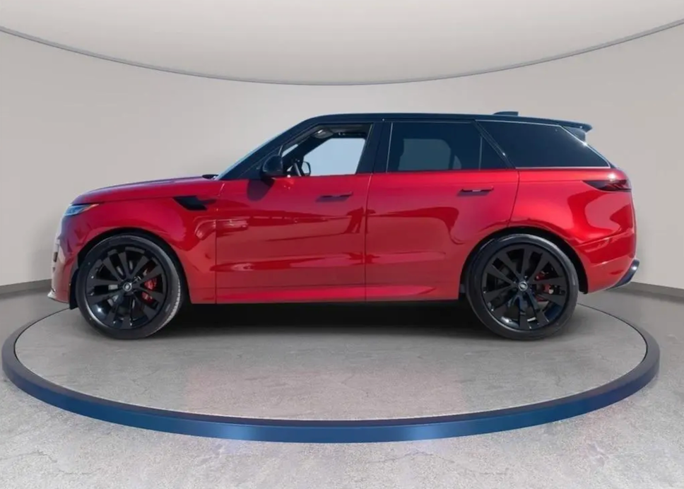 Red SUV on a turntable with a neutral background