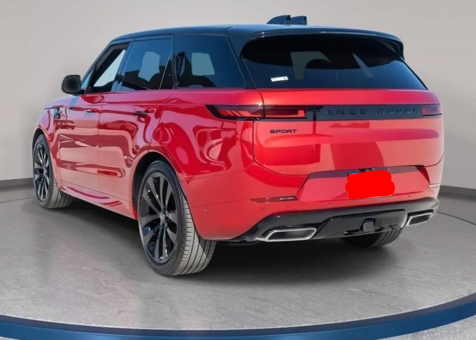 Red SUV on a gray floor with a white wall background