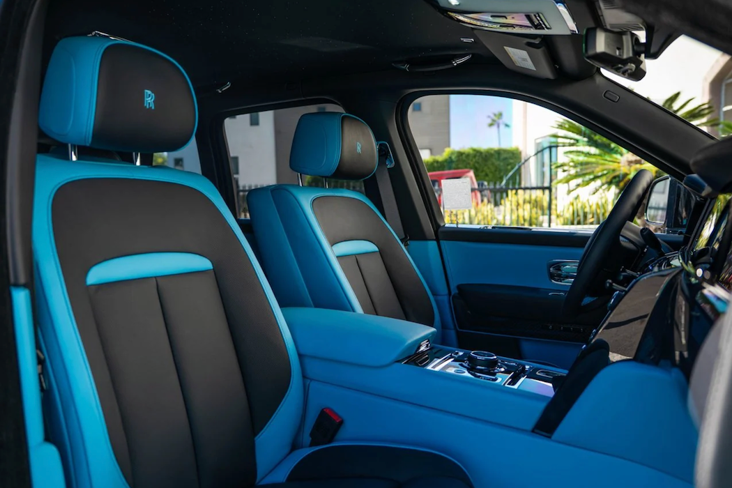 Luxury car interior with blue and black seats