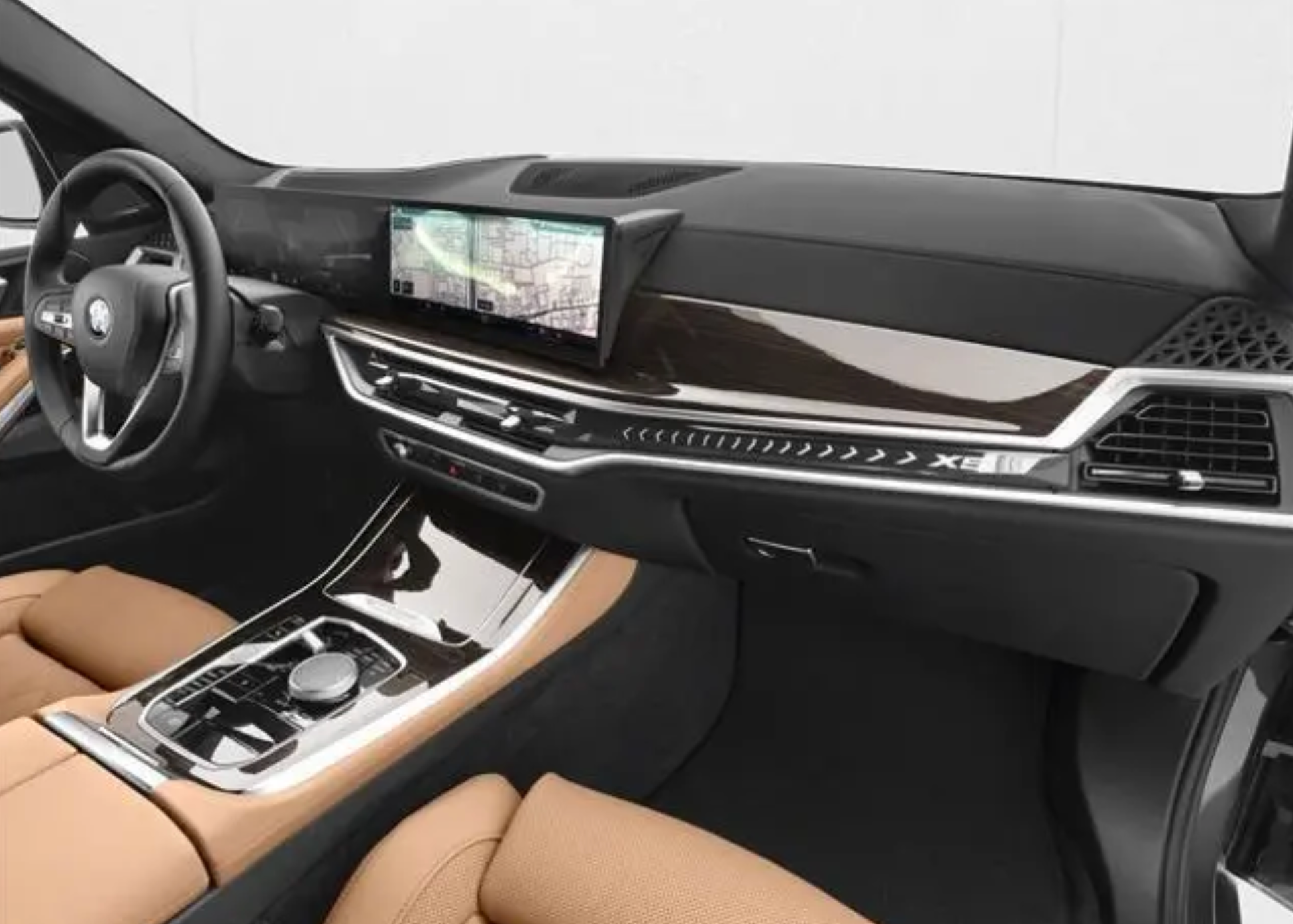 Car interior with dashboard, steering wheel, and center console.