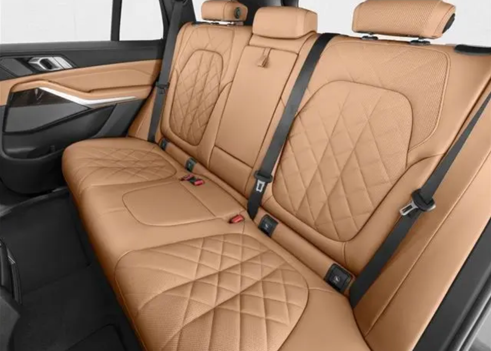 Beige car seat covers with quilted pattern in a vehicle interior