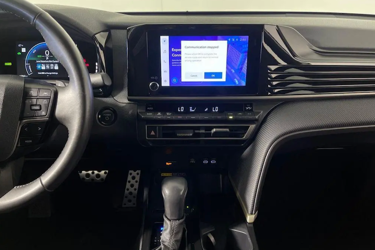 Car interior with digital display and steering wheel