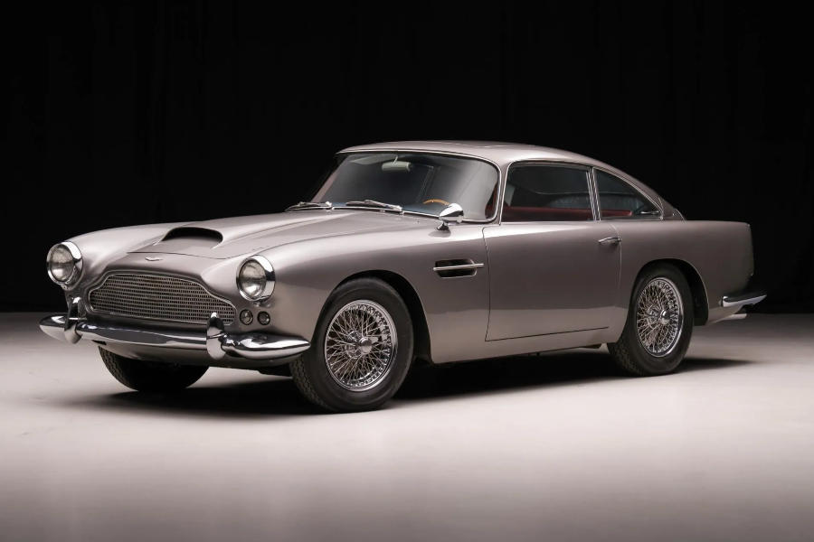Vintage silver car on a black background