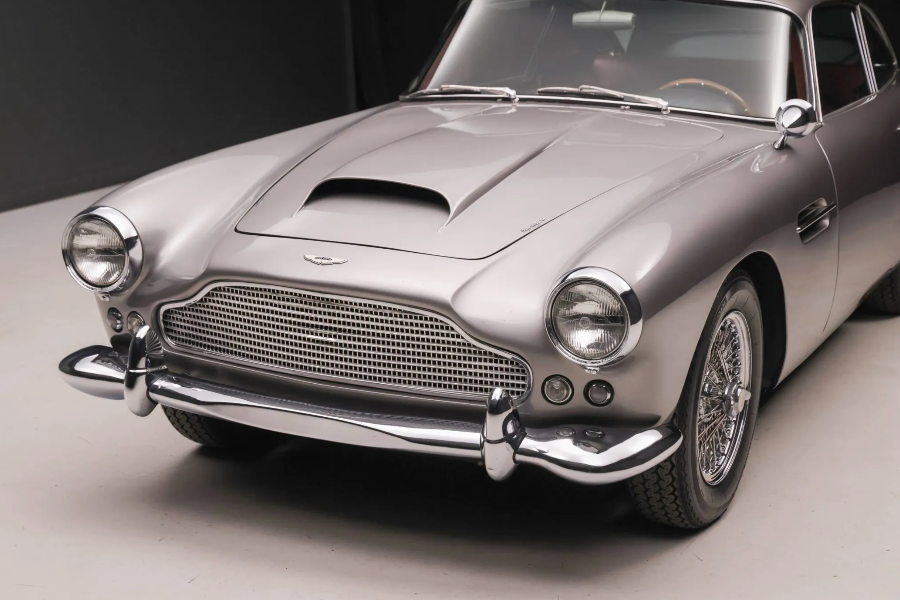 Silver vintage car on a gray background