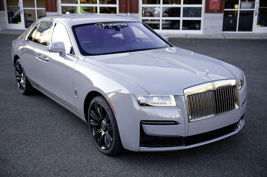 Luxury car parked on a street with a building in the background