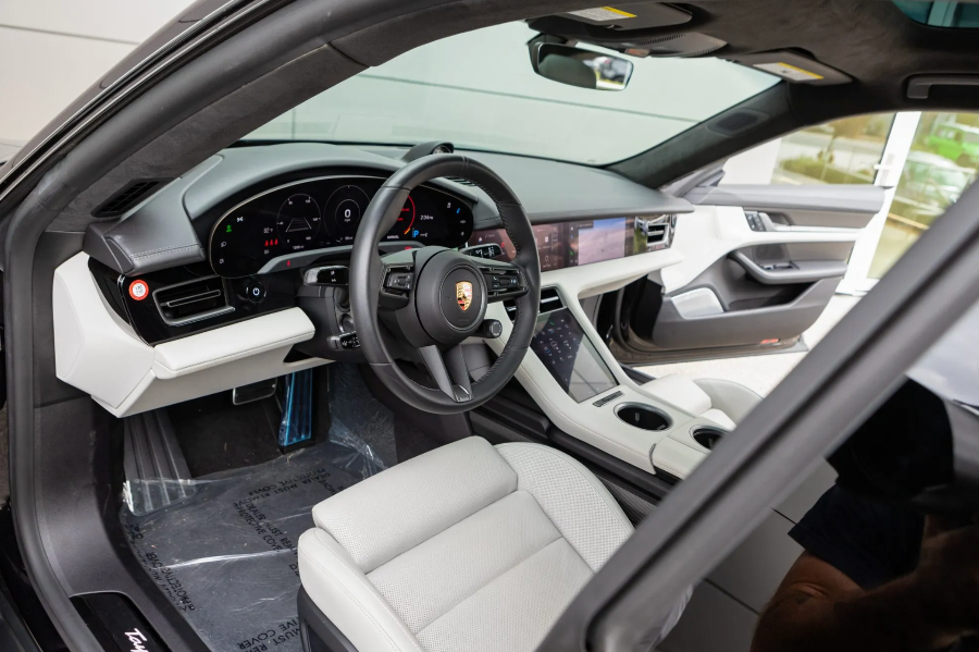Car interior with steering wheel and dashboard in a Porsche vehicle