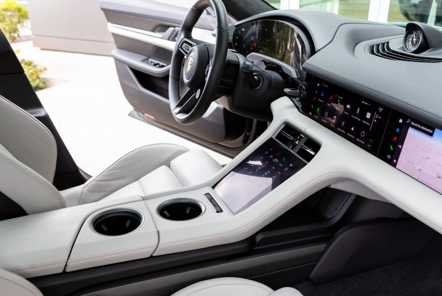 Car interior with steering wheel and dashboard in a modern vehicle.