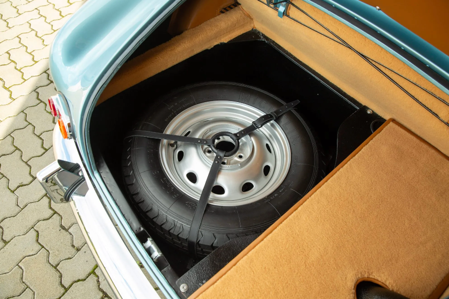 Car trunk with spare tire and wheel inside
