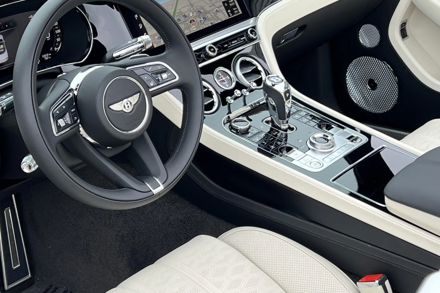 Luxury car interior with steering wheel and dashboard