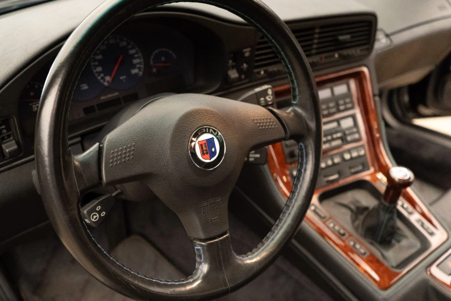 Steering wheel with a logo in a car interior
