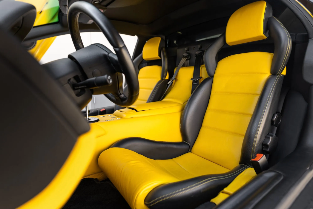 Car interior with yellow seats and black accents