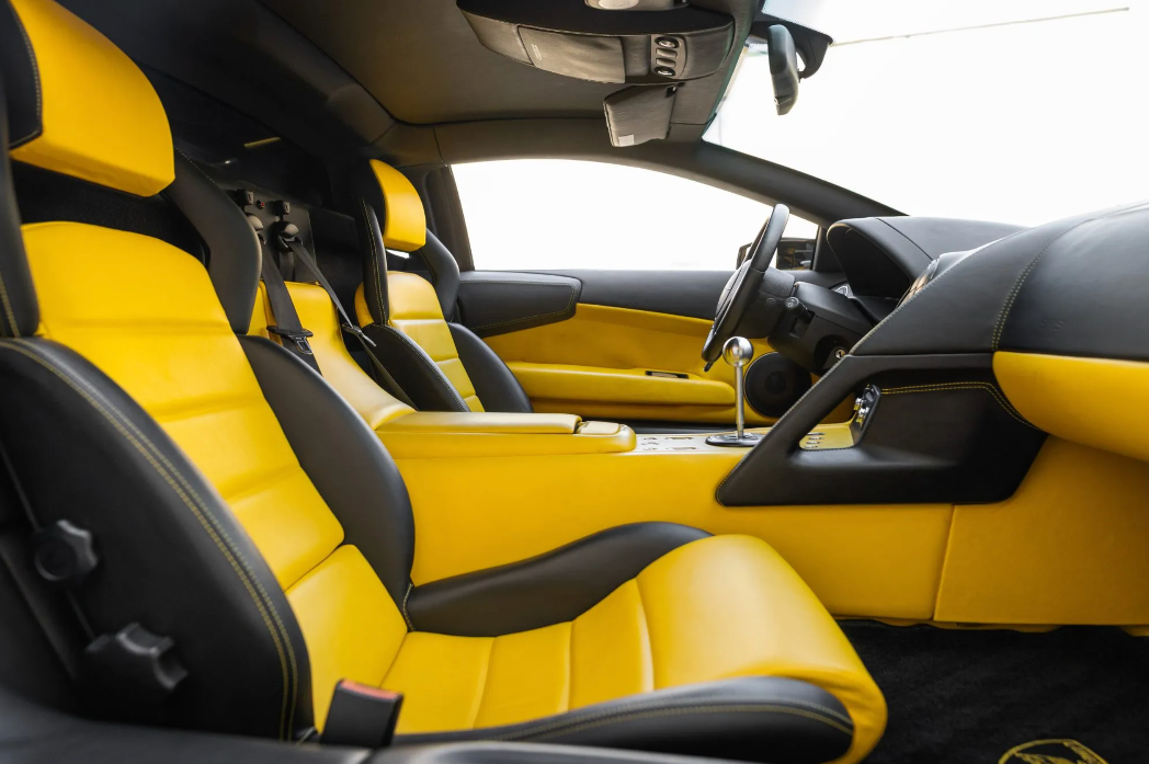 Car interior with yellow seats and black accents